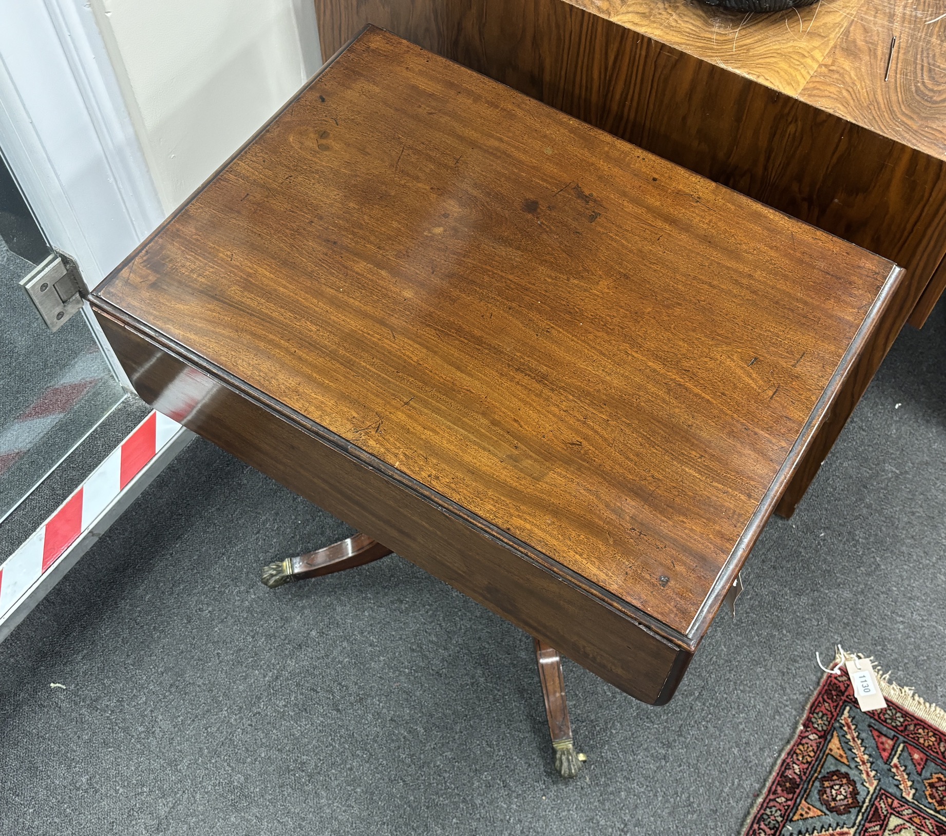 A Regency ebony strung mahogany drop flap two drawer work table, width 45cm, depth 64cm, height 67cm.